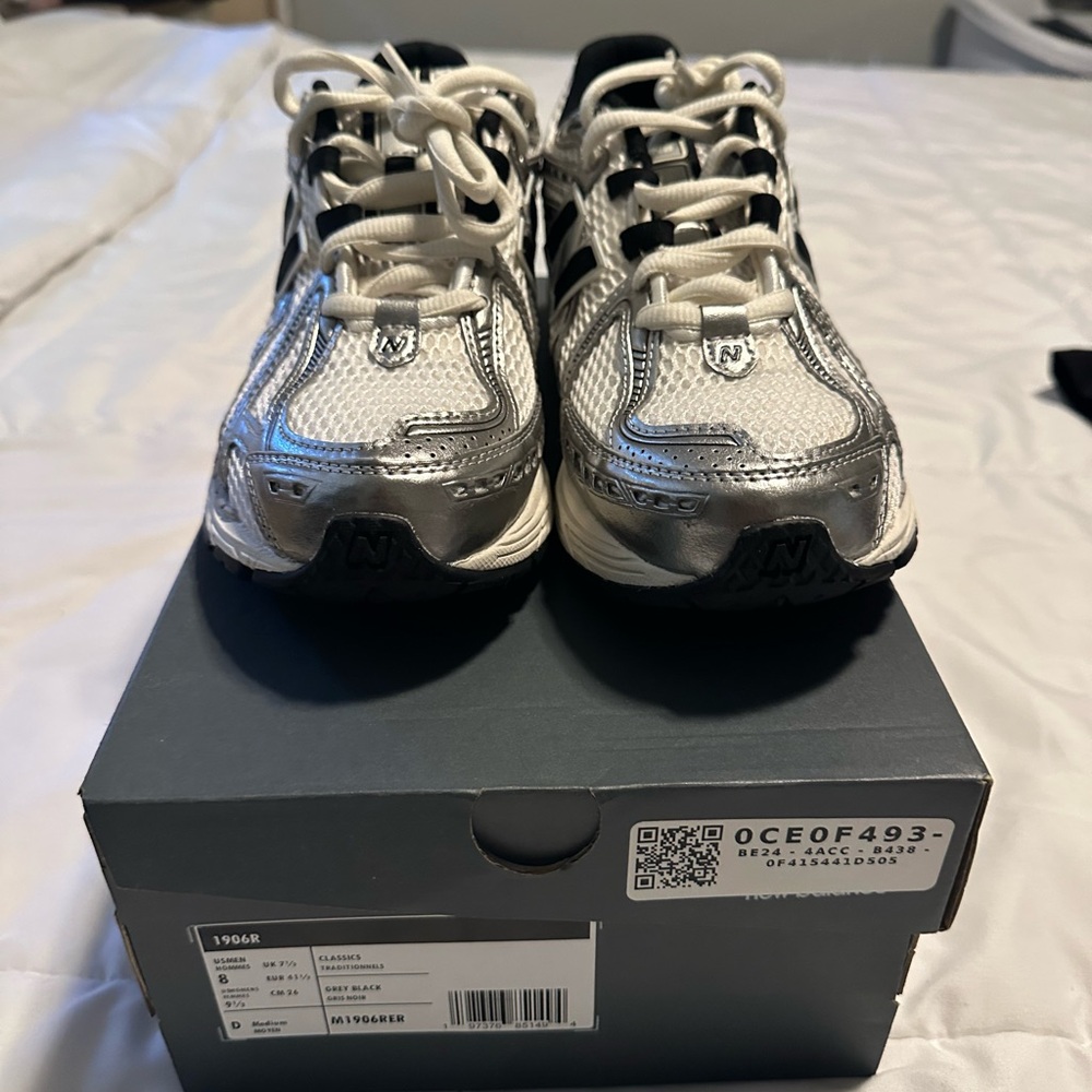 New Balance Metallic Silver and Black Sneakers